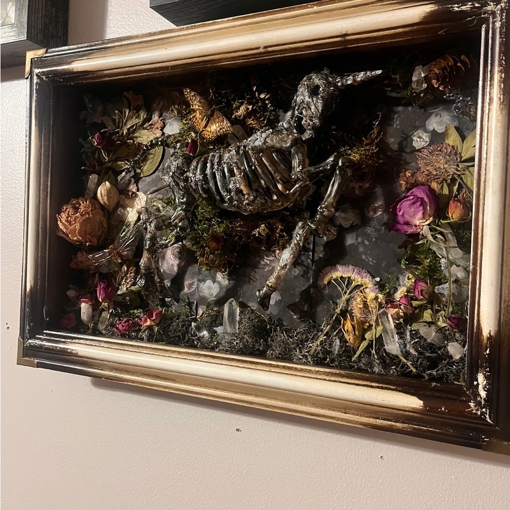 faux baby unicorn mummy wihh the real preserved insects and dried flowers